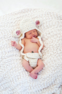 Newborn Baby Wearing a Lamb Costume