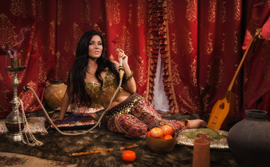 Beautiful arabic woman with hookah