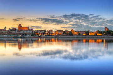 Torun old town reflected in Vistula river at sunset, Poland © Patryk Kosmider