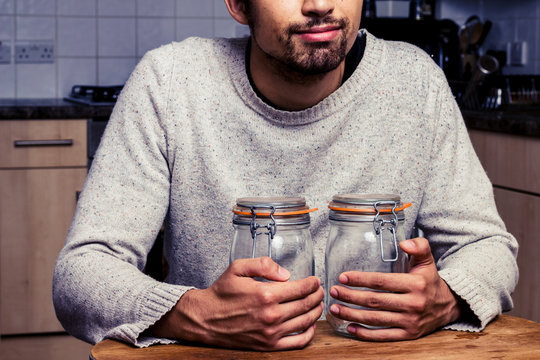 Man with two jam jars