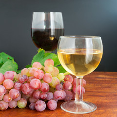 grape and wine on wood