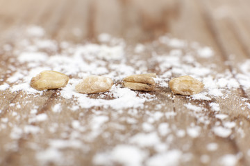 Fototapeta na wymiar close up of wheat seeds with flour