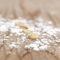 Fototapeta na wymiar close up of wheat seeds with flour