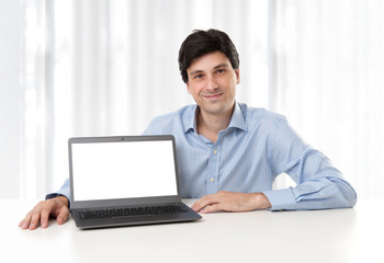 businessman displaying laptop with blank screen