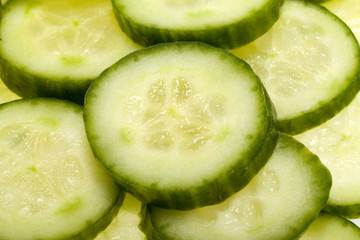 Freshly sliced cucumber  isolated on white background