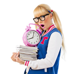 Surprised girl holding books and clock