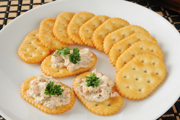 Smoked salmon spread on crackers