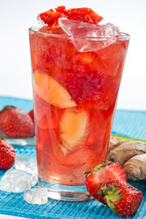 Red drink with ginger and strawberry