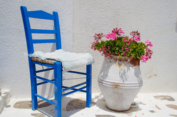 Traditional blue greek chair against white wall