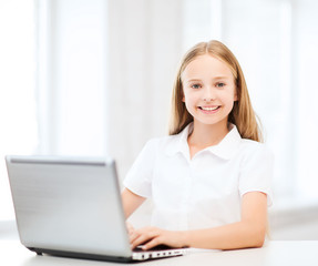 girl with laptop pc at school