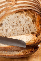 Sliced ​​bread on a wooden board.