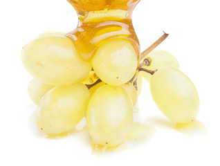 green grapes and honey isolated on white