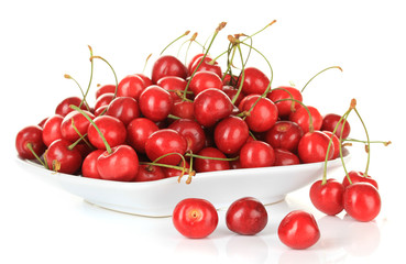Obraz na płótnie Canvas Cherry berries on plate isolated on white