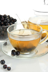 Cup of berry tea isolated on white