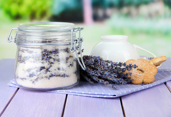 Jar of lavender sugar and fresh lavender flowers