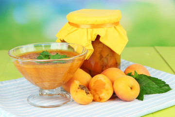 Apricot jam in glass jar and fresh apricots,