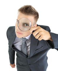 Fototapeta na wymiar Young businessman looking through magnifying glass isolated