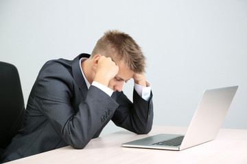 Portrait of young businessman working in office