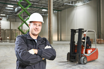 warehouse worker in front of forklift