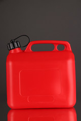 Plastic canister on grey background