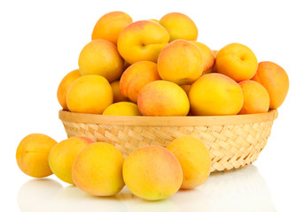 Fresh natural apricot in wicker basket isolated on white