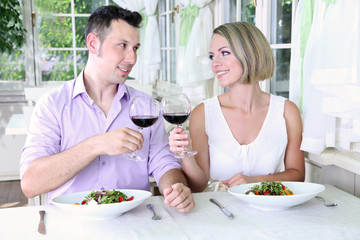 Beautiful couple having  romantic dinner at restaurant
