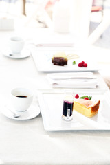 Fototapeta na wymiar Tasty desserts on white plate, at restaurant