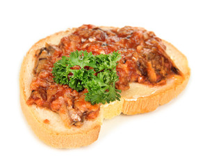 Tasty sandwich with sardines and tomato sauce, isolated on
