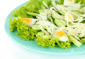 Delicious salad with eggs, cabbage and cucumbers, isolated