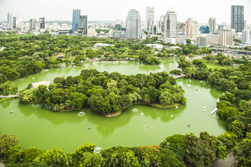 Modern city Lumpini park green space in Bangkok