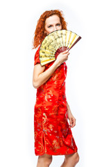 Obraz premium young and beautiful woman in a red Chinese dress