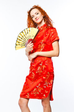 young and beautiful woman in a red Chinese dress