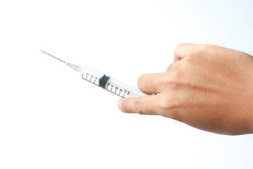 Fototapeta premium Hand holding syringe