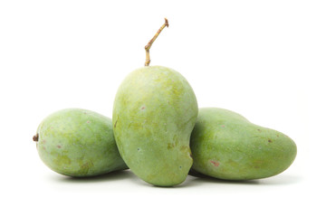 Green mangoes on white