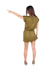 Back view of  pointing woman.