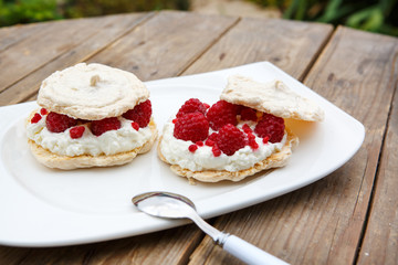 Pear cake stuffed with jam and covered with white meringue
