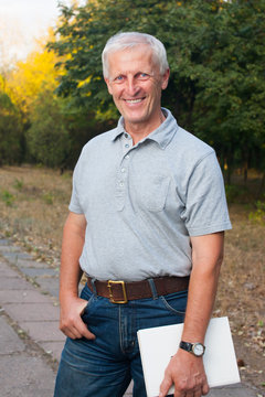 Happy emotional old man smiling