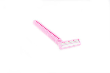 Closeup of pink shaving blade on white surface