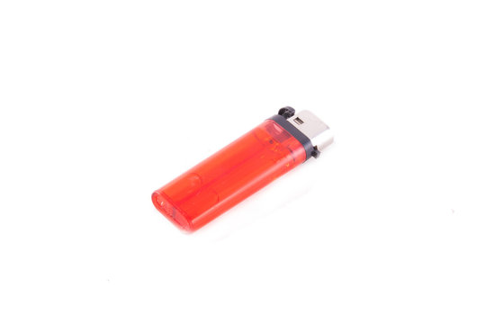Red cigarette lighter. Isolated on white.
