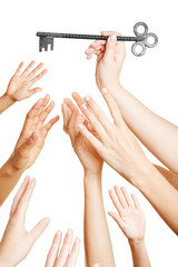 Many hands reaching for key