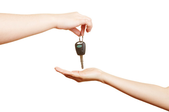 Hand offering car keys