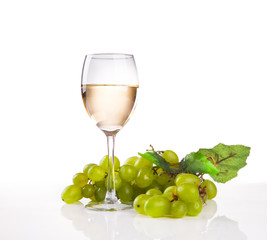 wineglass with white wine and grape on white background