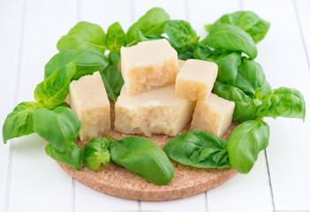 Parmesan cheese and basil leaves