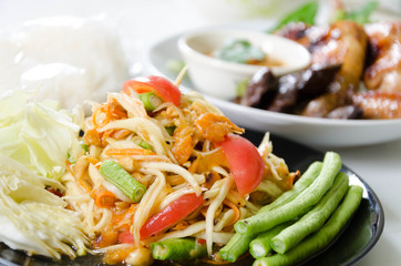 Spicy papaya salad somtum  and Roasting chicken