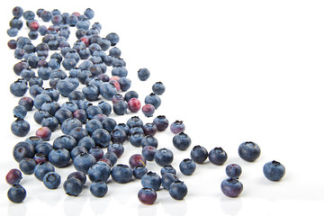 Spilling on the table blueberries