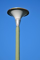 Street pole light with blue sky in background