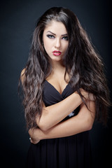 Naklejka premium beautiful young woman in black dress