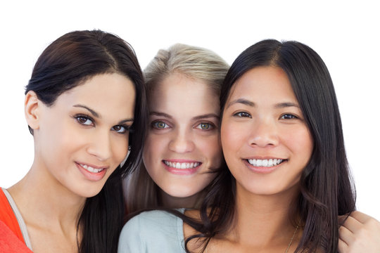 Diverse young women smiling at camera