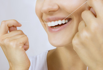 Woman and teeth floss