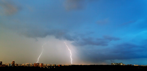 two lightning strikes over city